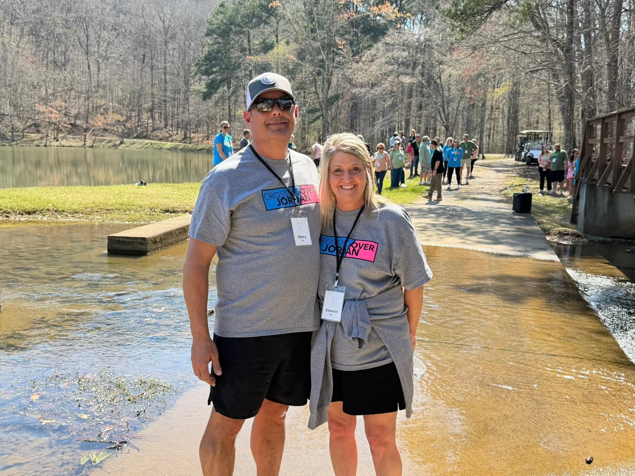 Danny and Shannon at a Crossing Over Jordan retreat, standing by the water