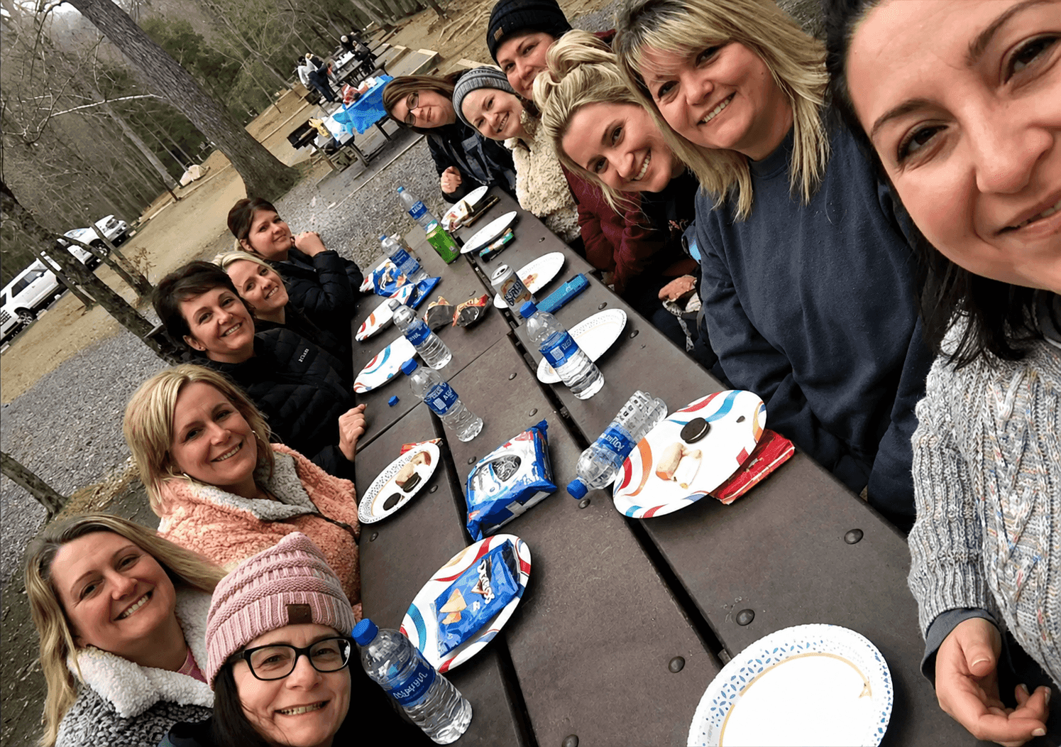 The first COJ trip — twelve women gathered around the table in Gatlinburg
